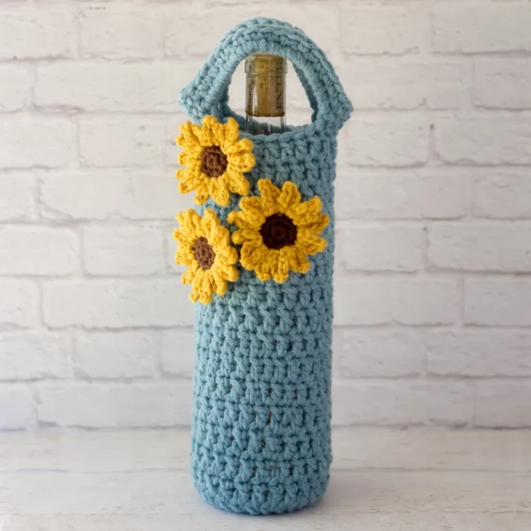Colorful crochet blanket and wine cozy showcasing cozy crochet ideas for winter warmth.