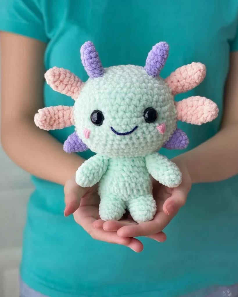 Crochet Plush Axolotl amigurumi pattern displayed on a soft background
