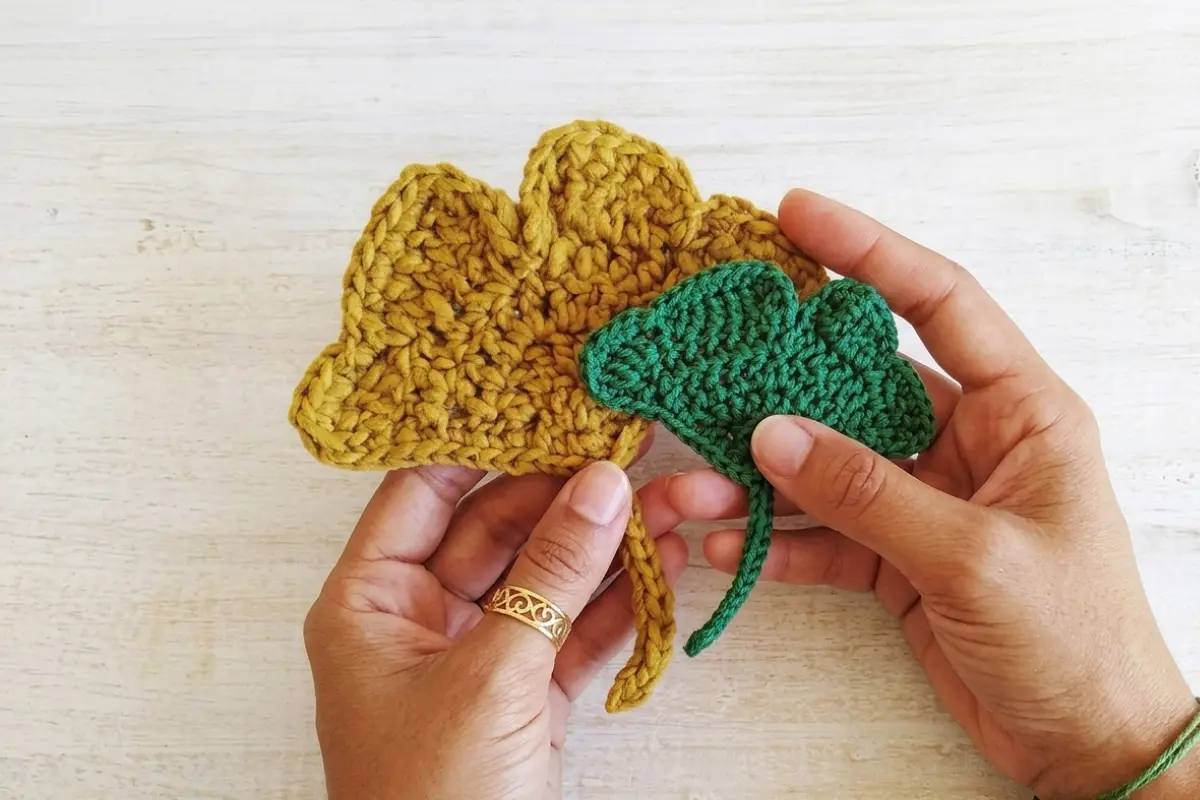 Crochet Ginkgo Leaf Pattern made with green DK cotton yarn and a crochet leaf stem