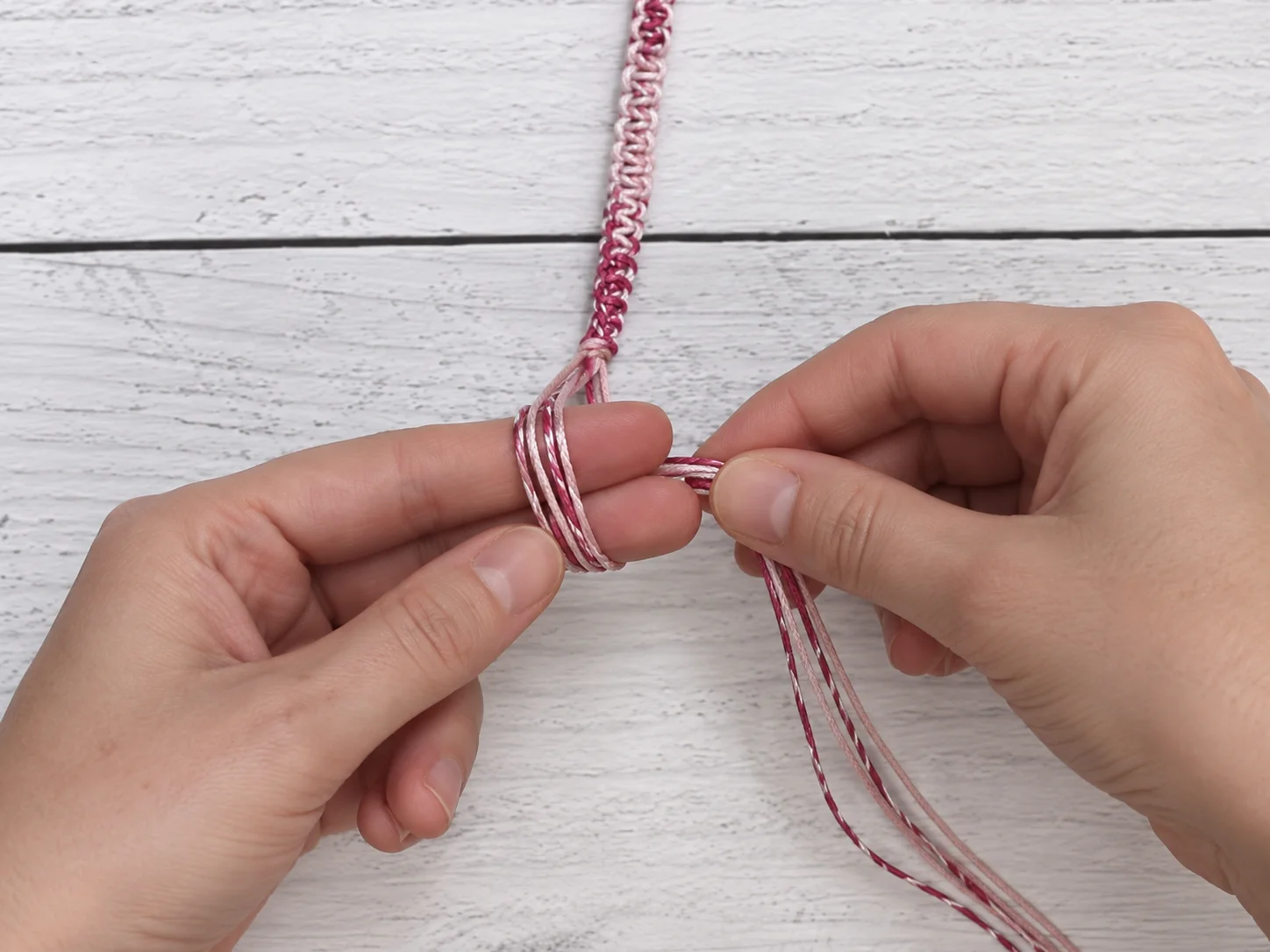 Step 10 wrapping the loose hemp cord ends around two fingers to form the finishing loop