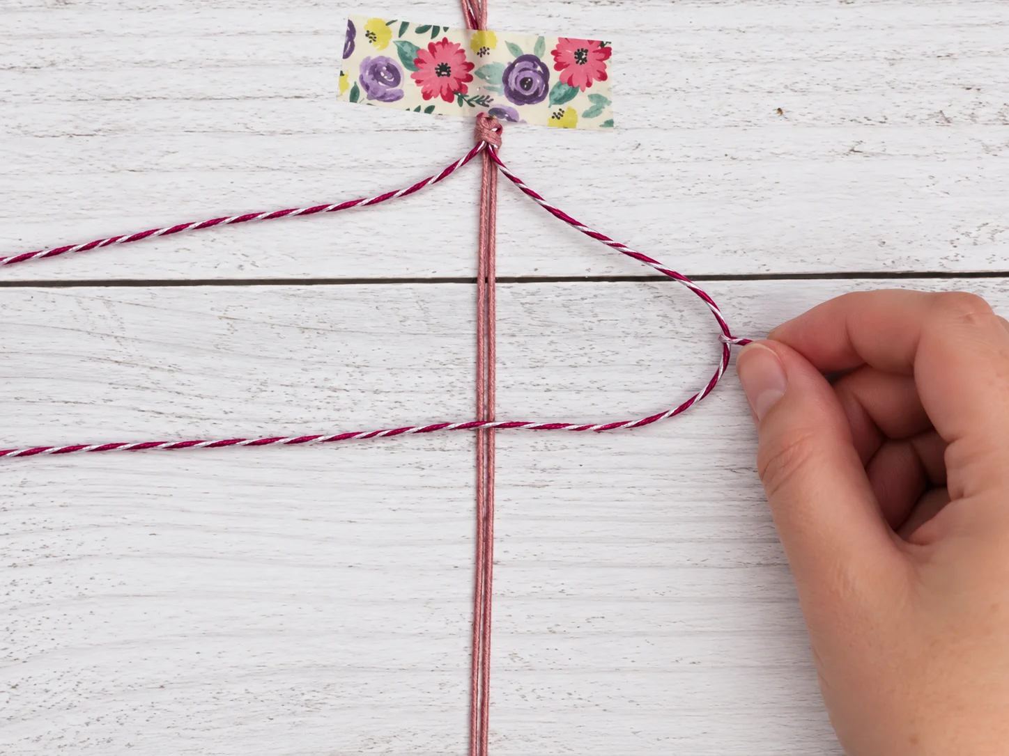 Step 4 crossing the right working cord over the two center cords to begin a square knot