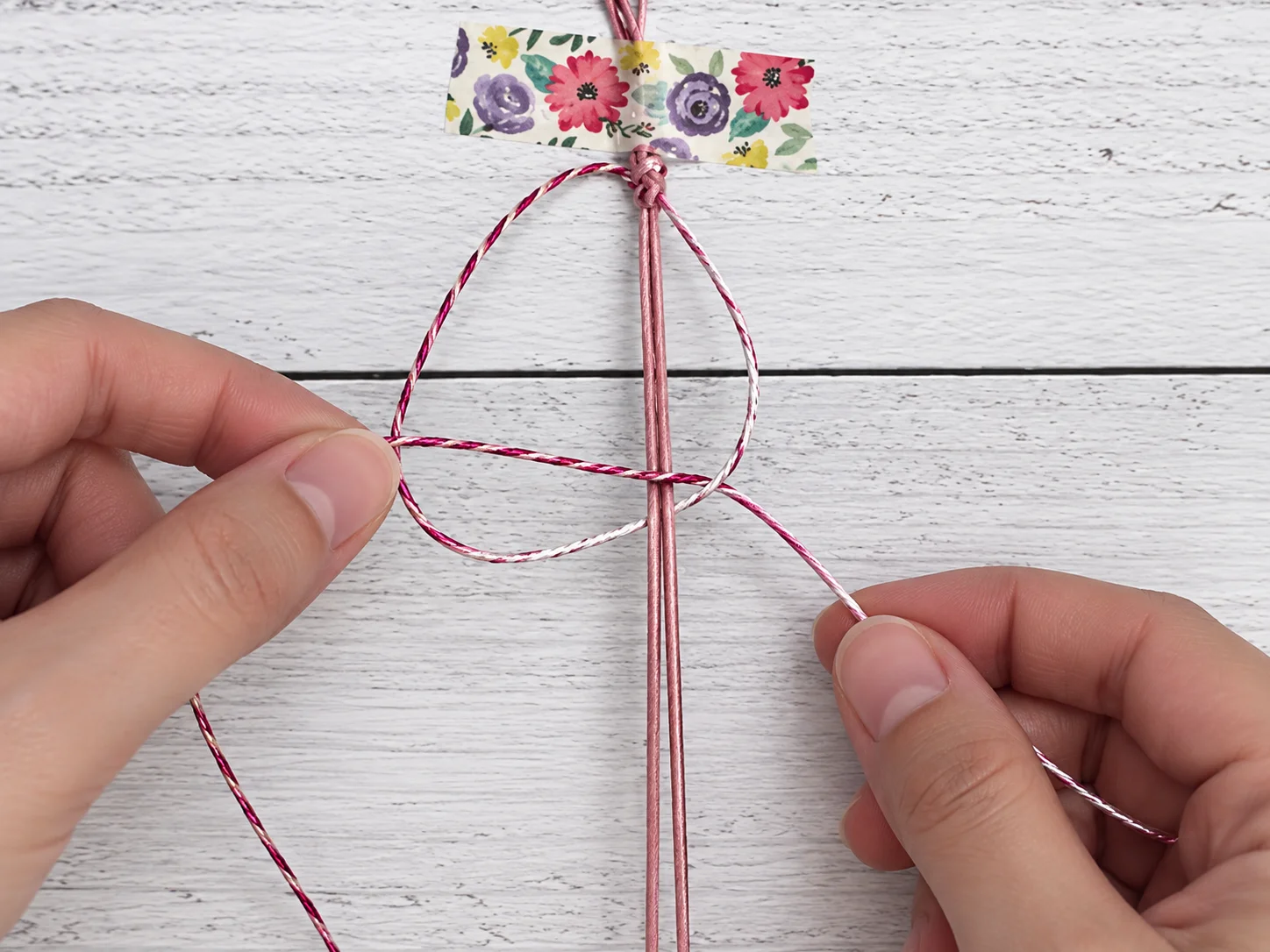 Step 7 starting the second half of the square knot from the left side