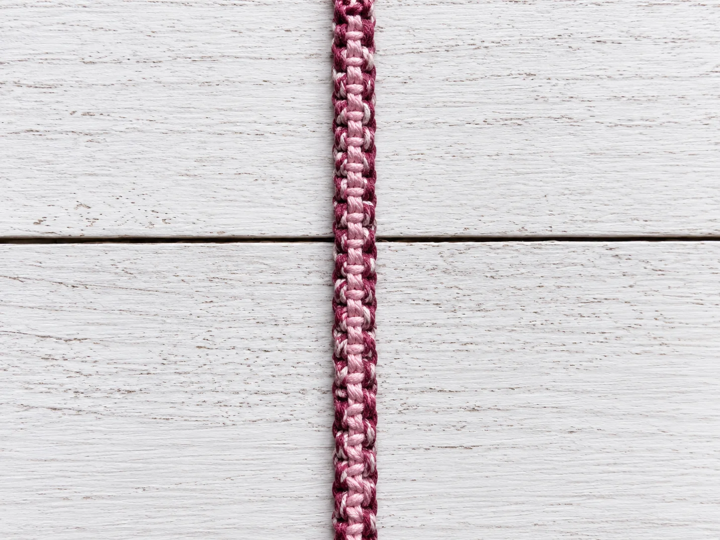 Step 9 repeating square knots to create the woven hemp bracelet pattern