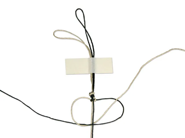 Step 7 passing the left cord behind the center cords and through the loop