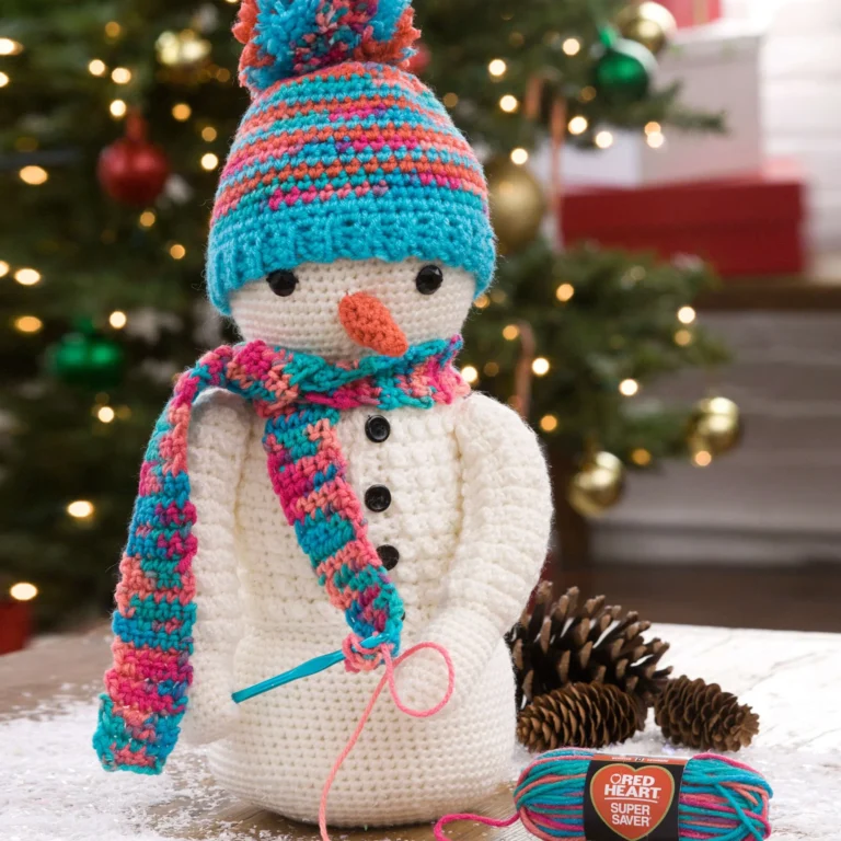 Simple crochet snowman pattern for beginners with festive details.