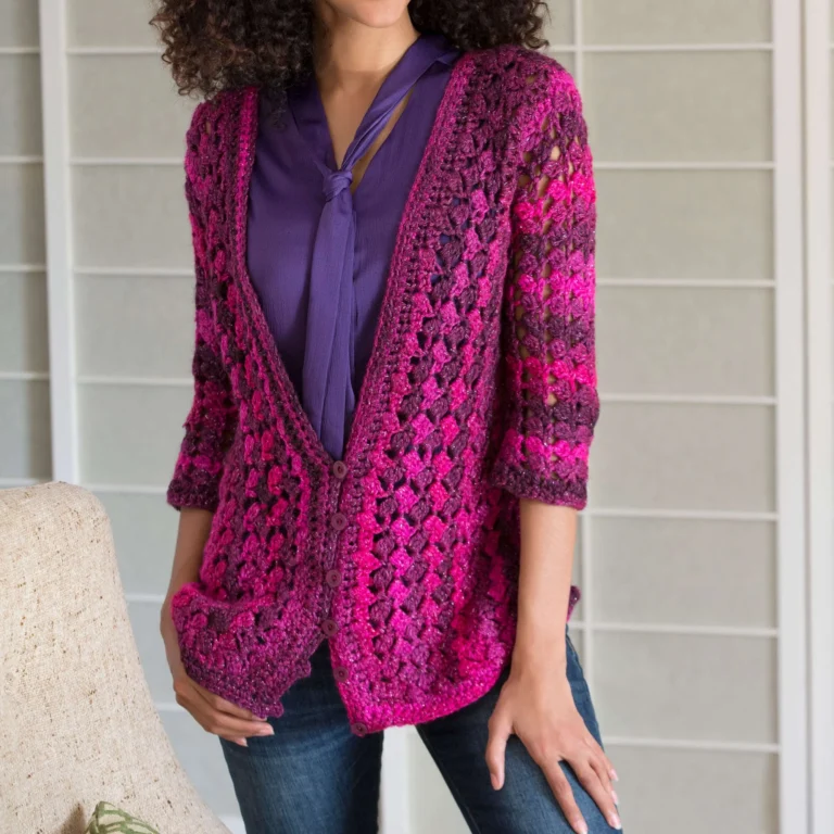 Lacy crochet cardigan pattern showcasing intricate design and soft yarn.