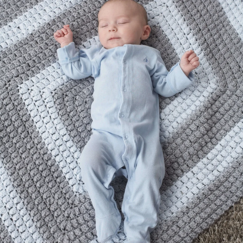 Universal crochet blanket pattern for every skill level with colorful yarn.
