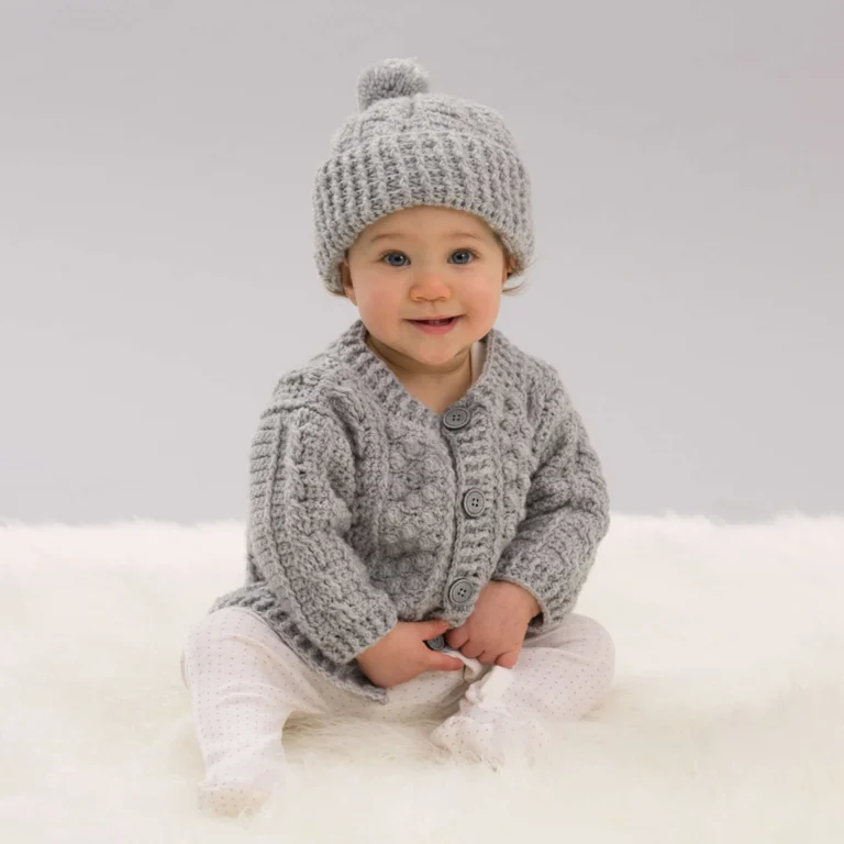 Aran-style crochet cardigan and hat pattern for cozy winter wear