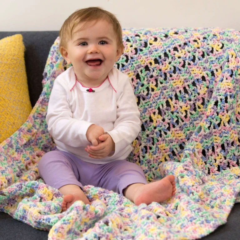 Baroque-inspired crochet baby blanket pattern beautifully crafted for infants.