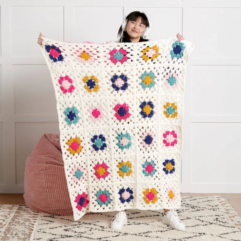 Beginner-friendly granny square crochet blanket pattern made with colorful squares