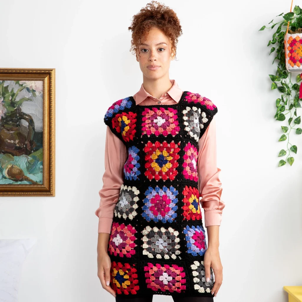 A collection of stylish crochet shift dress patterns laid out on a table.