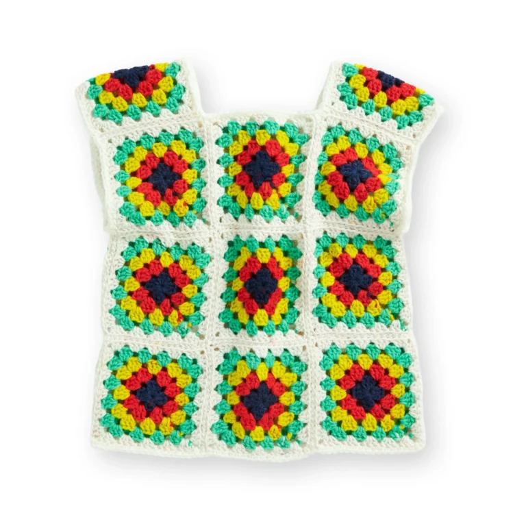 A stylish crochet vest paired with a casual t-shirt, showcasing intricate patterns.