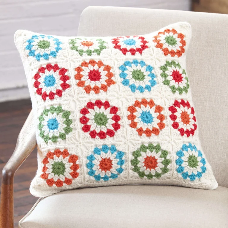 Copenhagen-inspired crochet pillow pattern displayed on a stylish couch