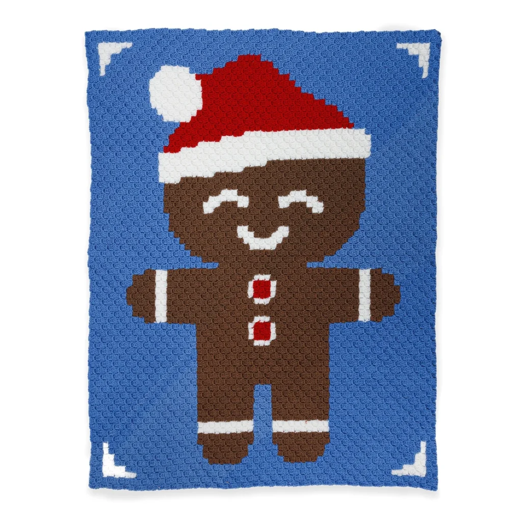 Cozy Gingerbread Friend Crochet Blanket in cozy colors and textures.