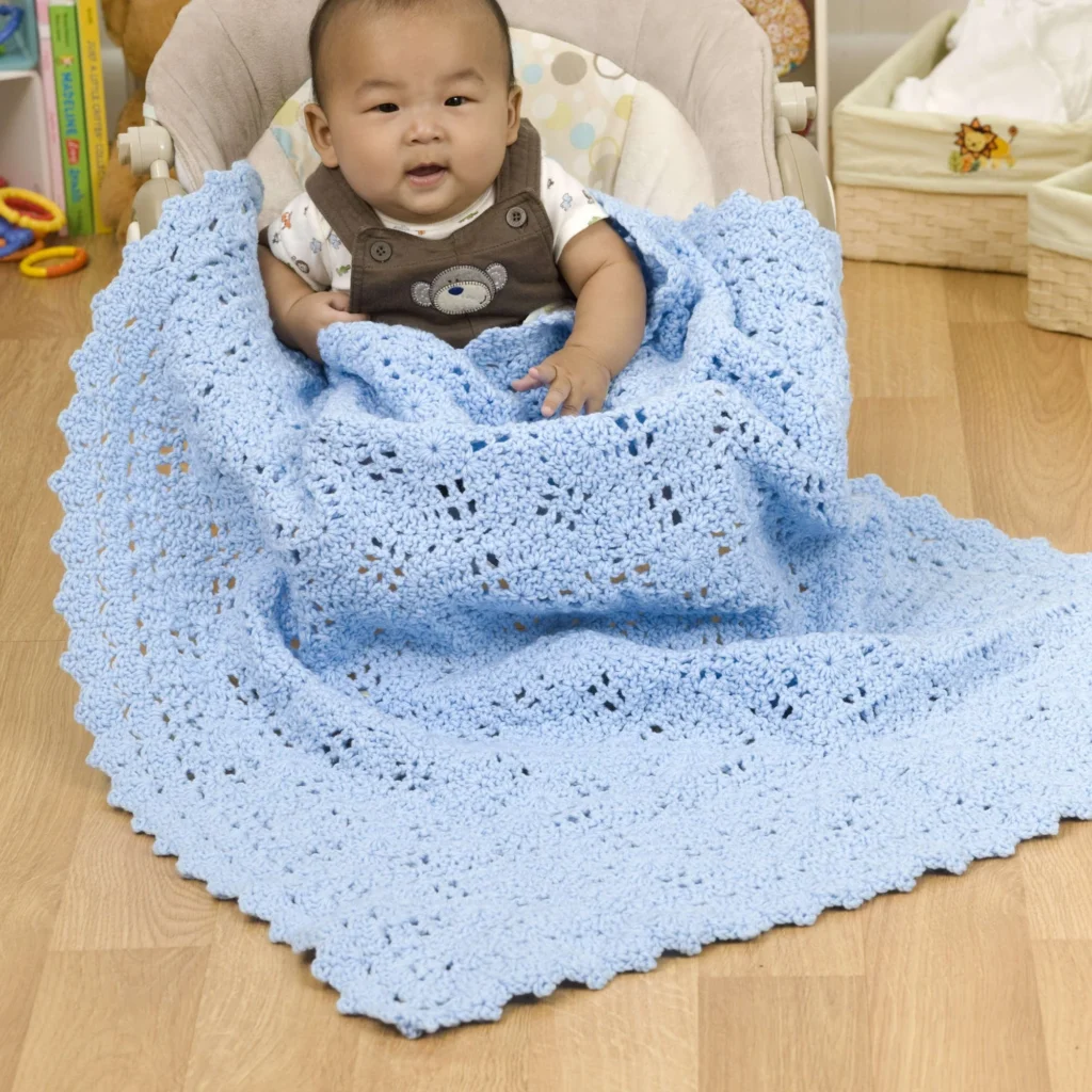 Colorful crochet baby blanket pattern inspired by building blocks for infants