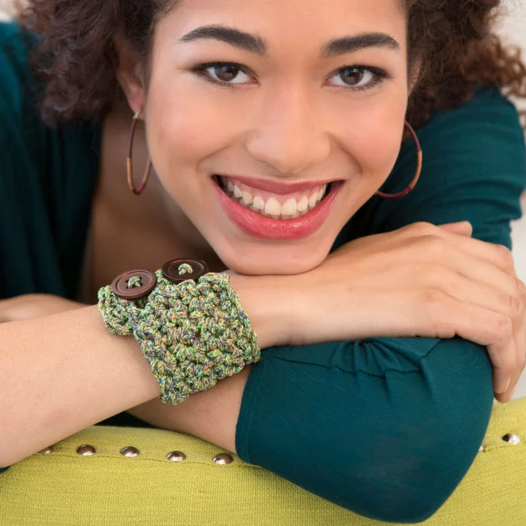 Crochet buttoned cuff bracelet pattern showcased in a vibrant design