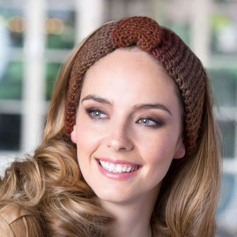 Crochet buttoned headband in a vibrant color, perfect for all seasons.