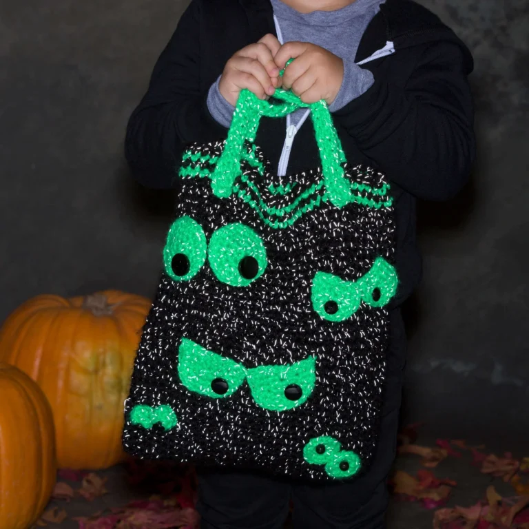 Crochet bag with creepy eyes design, showcasing unique crochet pattern.