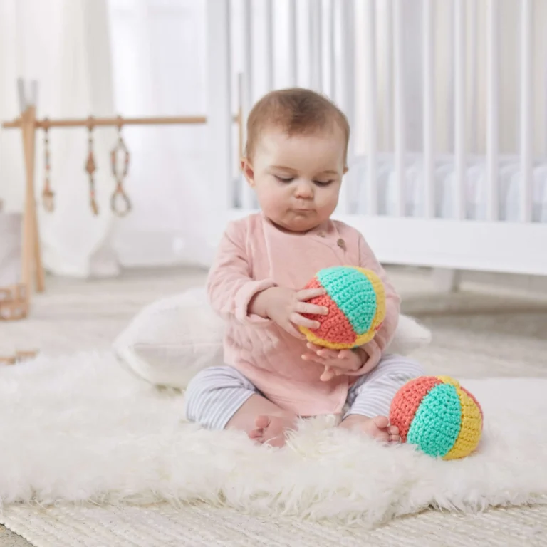 Crochet pattern for a colorful baby's first beach ball design