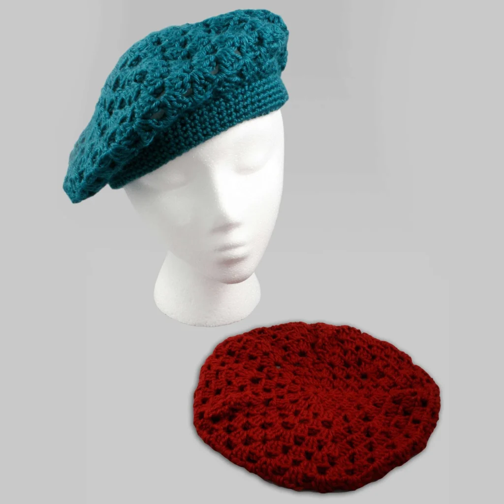Elegant crochet beret pattern displayed on a mannequin.