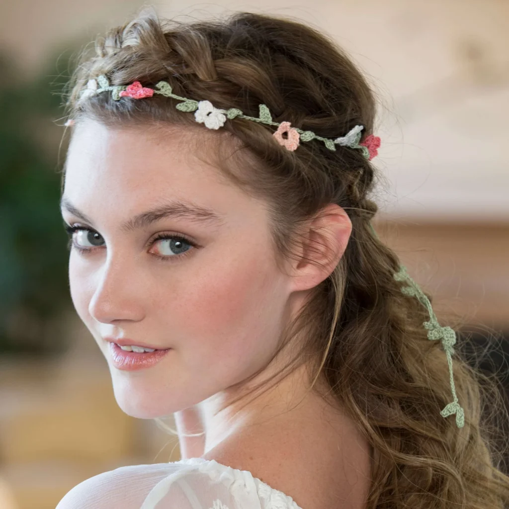 Elegant floral crochet headband showcasing intricate flower patterns