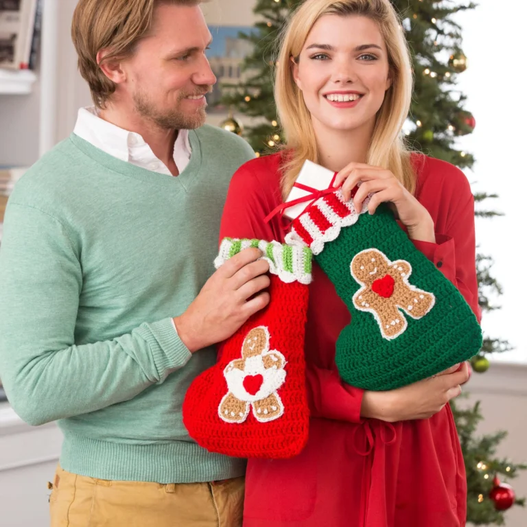 Crochet gingerbread stockings hanging by the fireplace for festive holiday decor