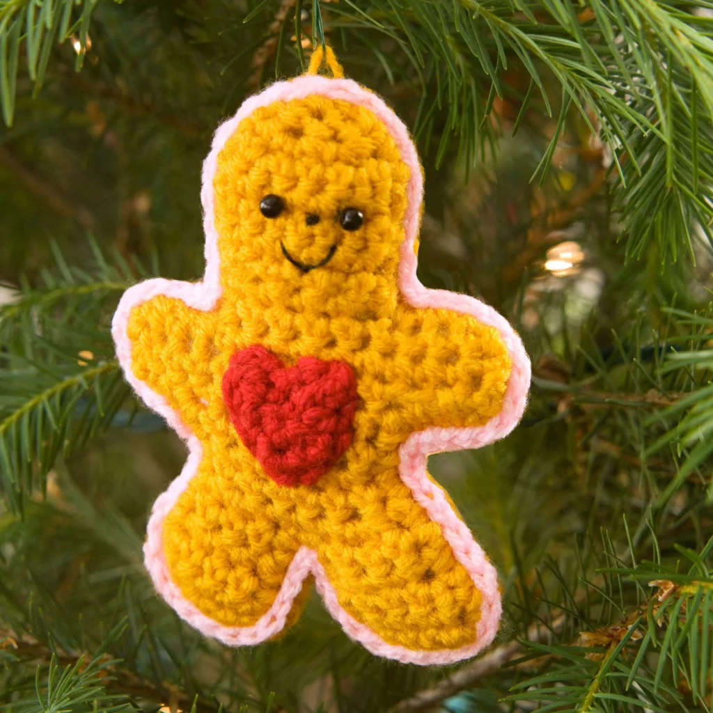 Gingerbread Boy crochet pattern featuring a heart ornament design