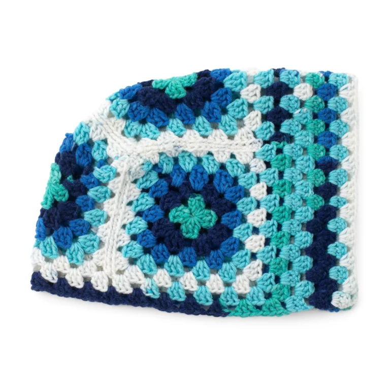Granny square couch cozy crochet pattern featuring colorful squares