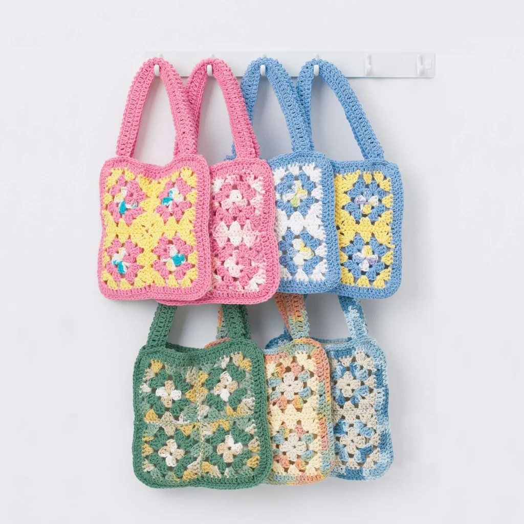 Granny square crochet bag pattern tutorial showcasing colorful handmade bags.
