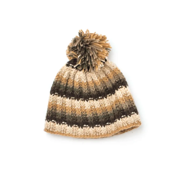 Tunisian Crochet Ribbed Hat Pattern displayed on a wooden table with yarn