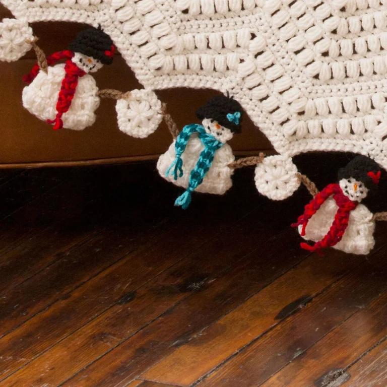 Whimsical Dancing Snowmen Crochet Throw pattern showcases adorable winter designs.