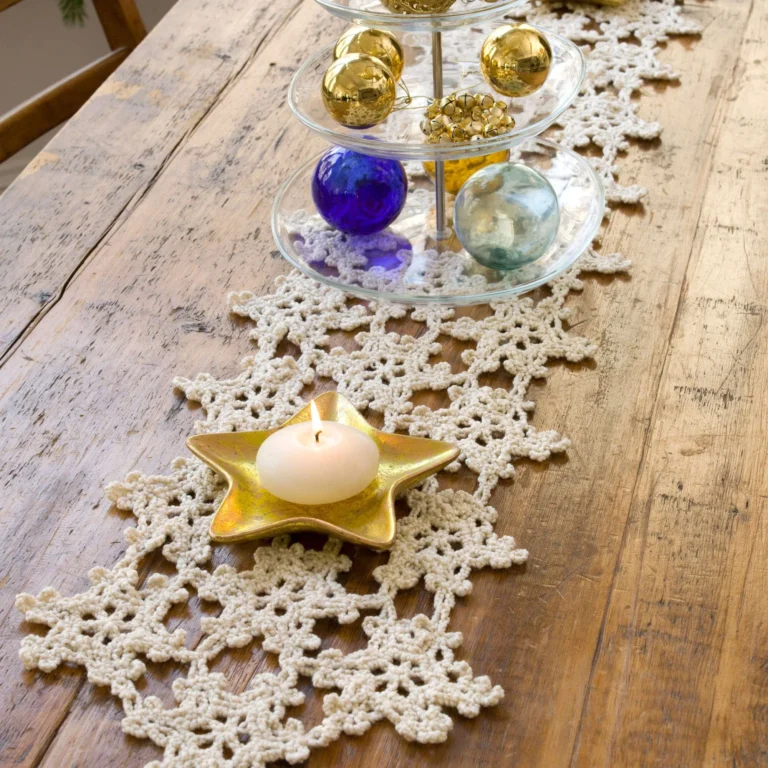 White snowflake crochet table runner pattern for winter decorations